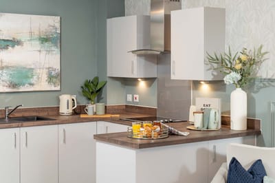 Modern kitchen area with a dining setup