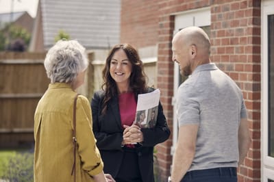 A staff member engaging with residents outdoors.