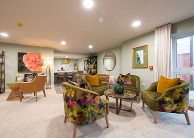 Colorful common area with seating and artwork.