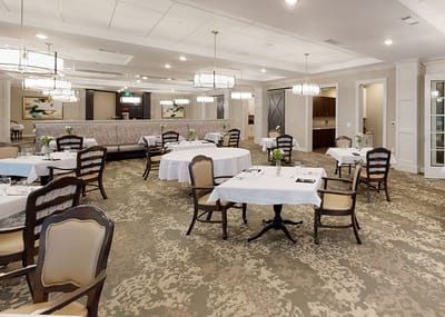 Elegant dining room with tables set for meals