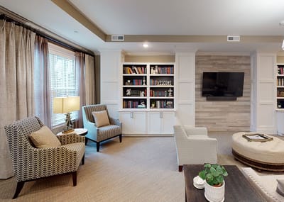 Cozy interior living area with seating and bookshelves