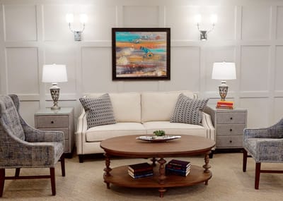 Cozy lounge area with a sofa and chairs