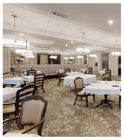 Elegant dining room with tables set for meals
