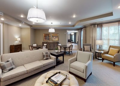 Bright common area with seating and dining tables
