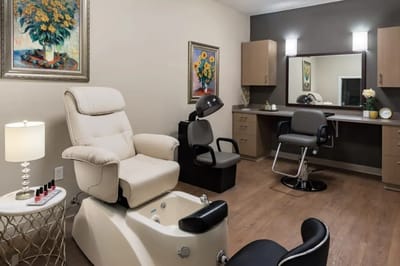 Interior view of a salon area with chairs and decor
