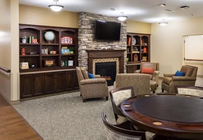 Interior view of a common area with seating and a fireplace