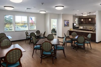Bright and spacious dining room with tables and chairs