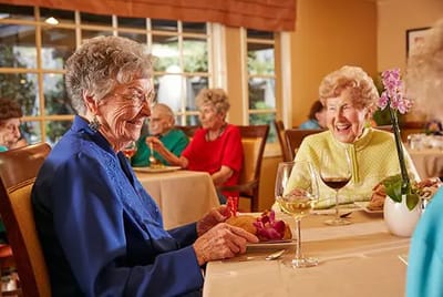 Residents enjoying a meal in the dining room