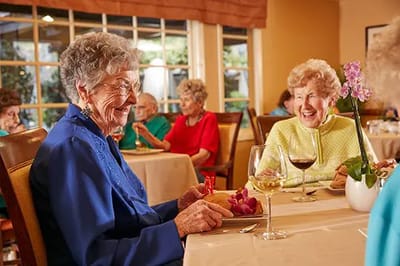 Residents enjoying a meal in the dining room