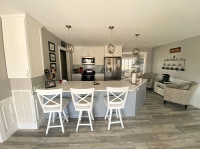 Bright kitchen area with modern appliances and seating