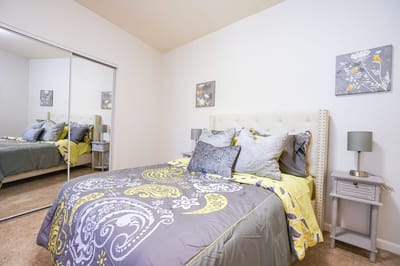 Cozy bedroom with decorative pillows and artwork