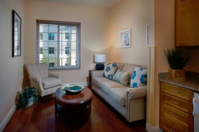 Cozy living space with a sofa and natural light
