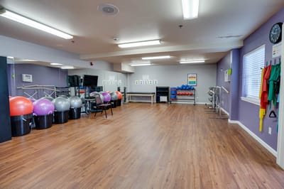 Bright interior of a therapy room with exercise equipment