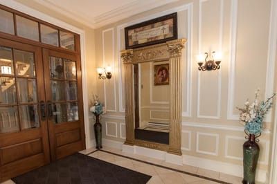 Elegant interior entrance with decorative mirror and lighting