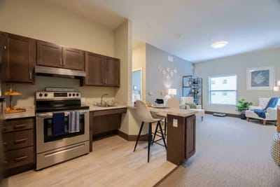 Modern assisted living apartment interior with kitchen area