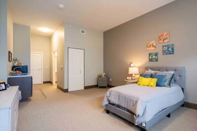A well-furnished private room in a senior living facility