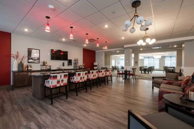 Modern common area with seating and a bar