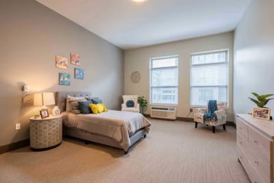 Bright interior view of a resident bedroom with decor