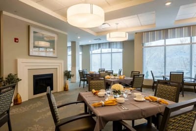 Dining area with beautifully set tables and natural light