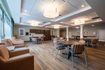 Bright common area with seating and tables