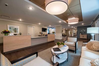 Bright lobby area with seating and reception desk
