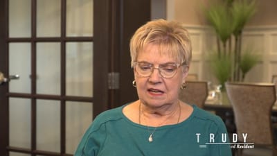 A resident named Trudy sitting inside a facility