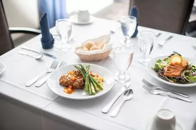 Elegant dining setup with gourmet meals served.