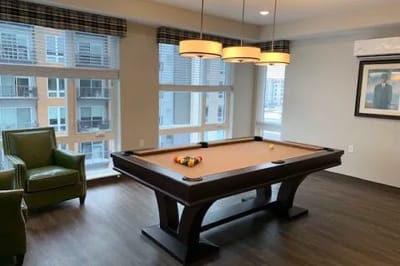 Interior common area with a pool table and seating