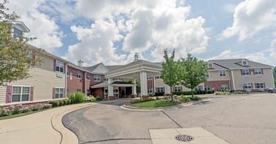 Exterior view of Heritage Woods of Huntley with landscaped entry