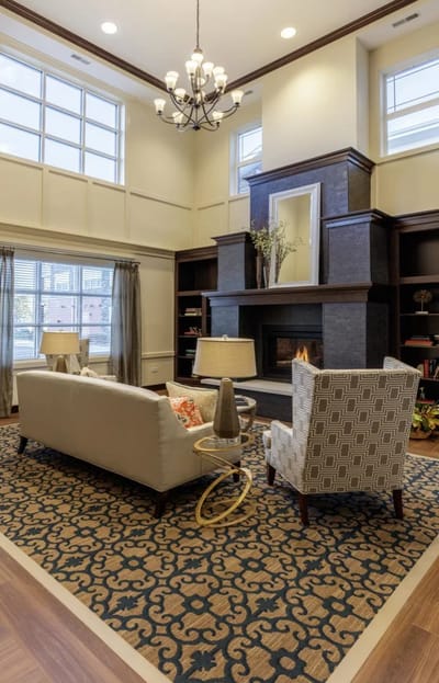 Cozy interior common area with seating and fireplace