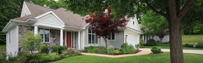 Exterior view of a residential building with landscaped garden