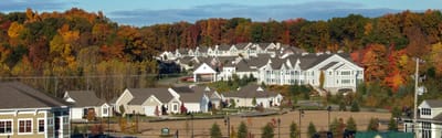 Aerial view of Cook Valley Estates surrounded by autumn foliage