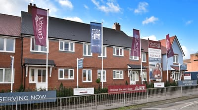 Exterior view of a residential retirement facility with banners