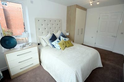 A well-furnished bedroom in a senior living facility