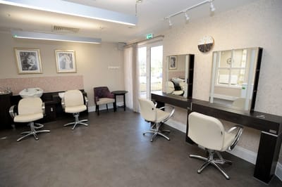 Interior of a beauty salon with styling chairs and mirrors