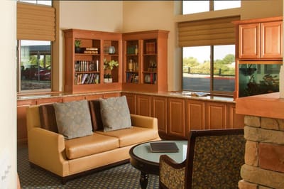 Cozy interior lounge with seating and shelves