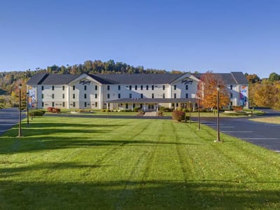 Exterior view of the facility with landscaped lawn