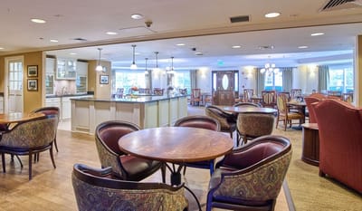 Interior view of a dining room with tables and chairs