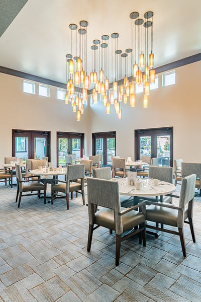 Bright dining area with decorative lighting and tables
