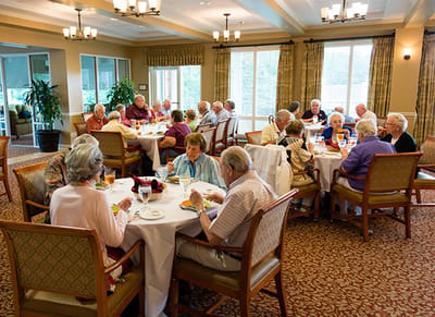 Residents enjoying a meal in the dining area