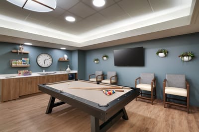 Interior activity room with a pool table