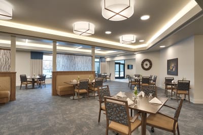 Bright dining area with tables and chairs