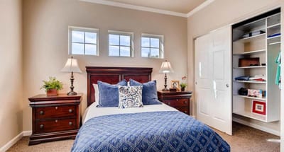 Well-appointed resident bedroom with natural light