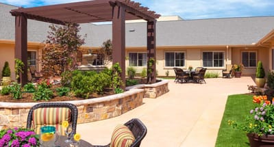 Well-maintained outdoor courtyard with seating and landscaping