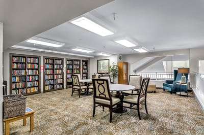 Bright common area with bookshelves and seating
