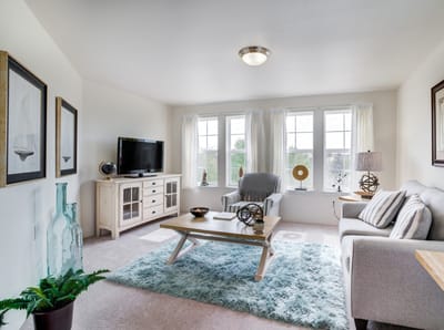Bright common area featuring comfortable furniture