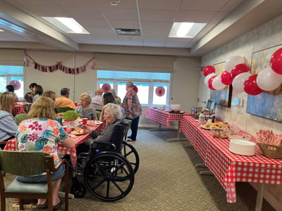Residents enjoying a festive meal in a common area