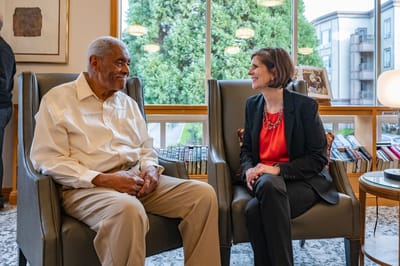 Resident and staff member engaging in conversation