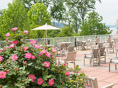 Outdoor patio area with flowers and seating