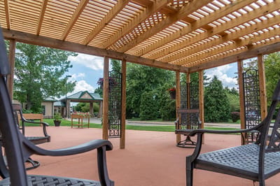 Outdoor seating area under a wooden pergola